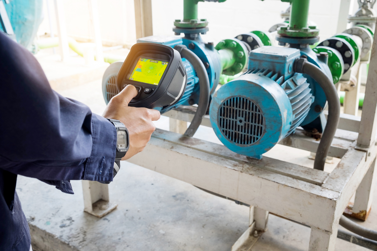 A Cornerstone Mechanical technician using thermal imaging camera to check a machine