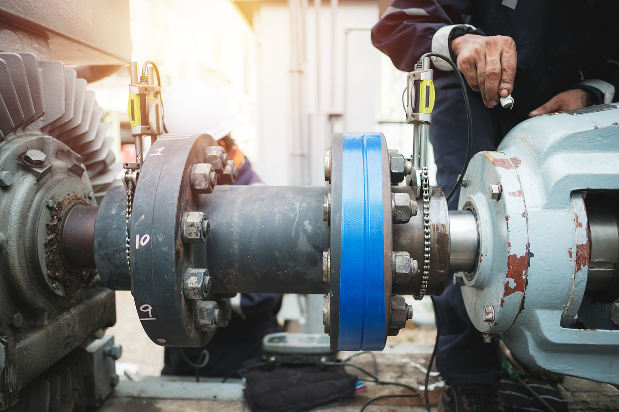 A technician from Cornerstone Mechanical Services, Inc. conducting a laser alignment on a piece of rotating equipment