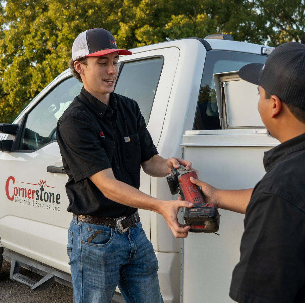 a man standing in front of a truck