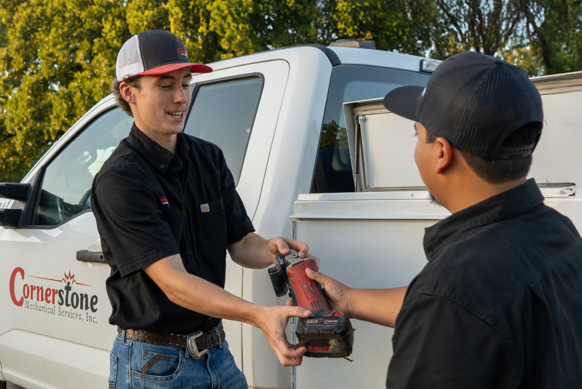 a man riding on the back of a truck