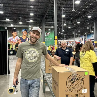 a man holding a sign posing for the camera